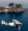 WWI biplane over the coast of Maine